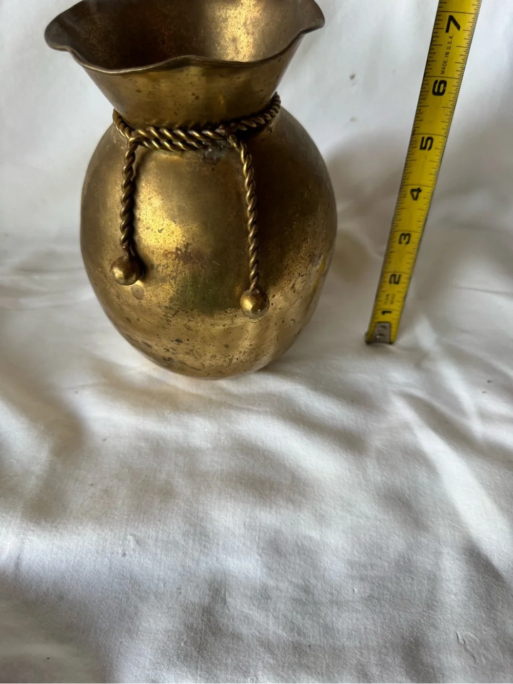 vintage solid brass vase from India featuring a distinctive ruffled rim and a de